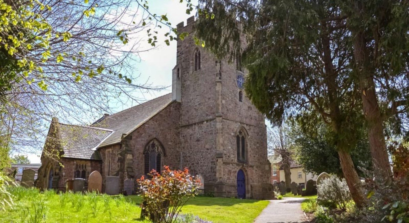 St Michael & All Angels&rsquo; Church, Thurmaston, seen from the churchyard path in spring