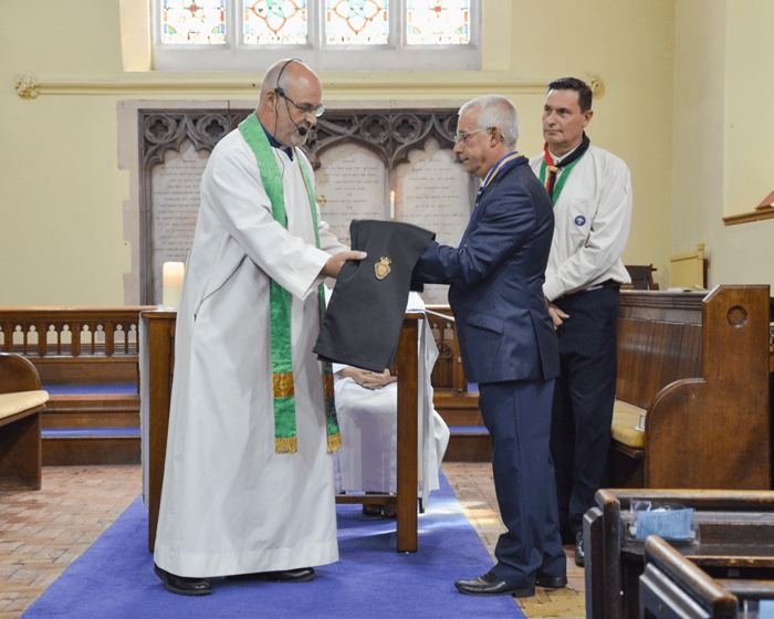 Rev Tim Day returning the RBL Branch Chaplain’s Stole to Cllr Andy Dent, RBL Branch Chairman